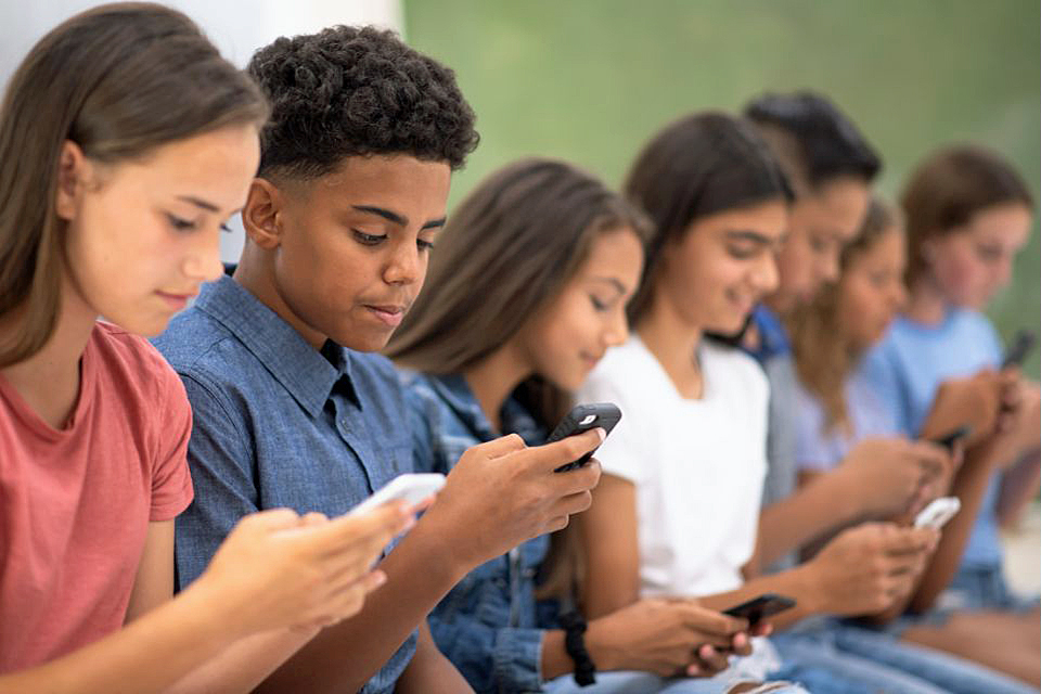What Does New York's Cell Phone Ban Look Like at Your School? When NYC kids head back to the classroom, cell phones must be out of sight. Photo via Canva